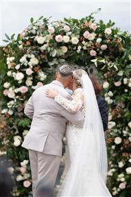 Bedfordshire same sex wedding at Shortmead house. Statement flower arch in blush colours with the brides standing in front of it