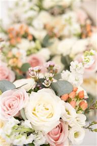 Stunning overview of bridal bouquets in blush tones including Roses, Waxflower, stocks, hypericum and eucalyptus