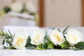 Classic white rose and greenery buttonholes