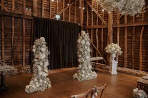 The Barn at Redcoats ceremony set up with floral pillars