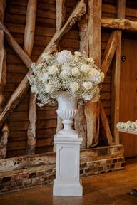 White gyp flower urns for The Barn at Redcoats wedding ceremony